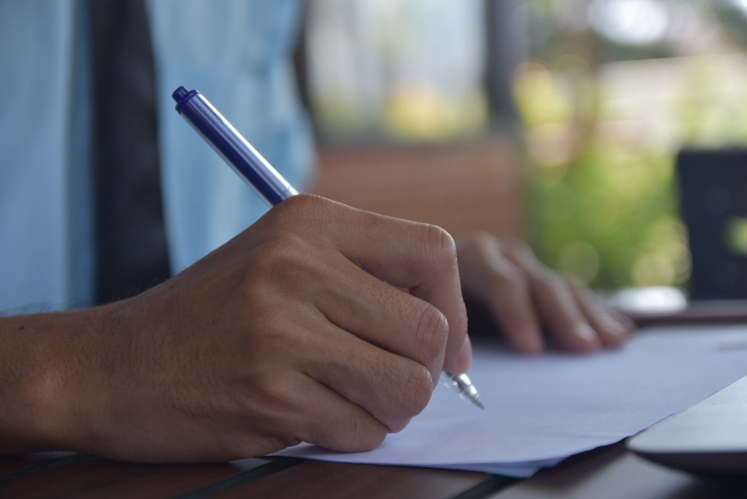 Hand writing on paper working job on table